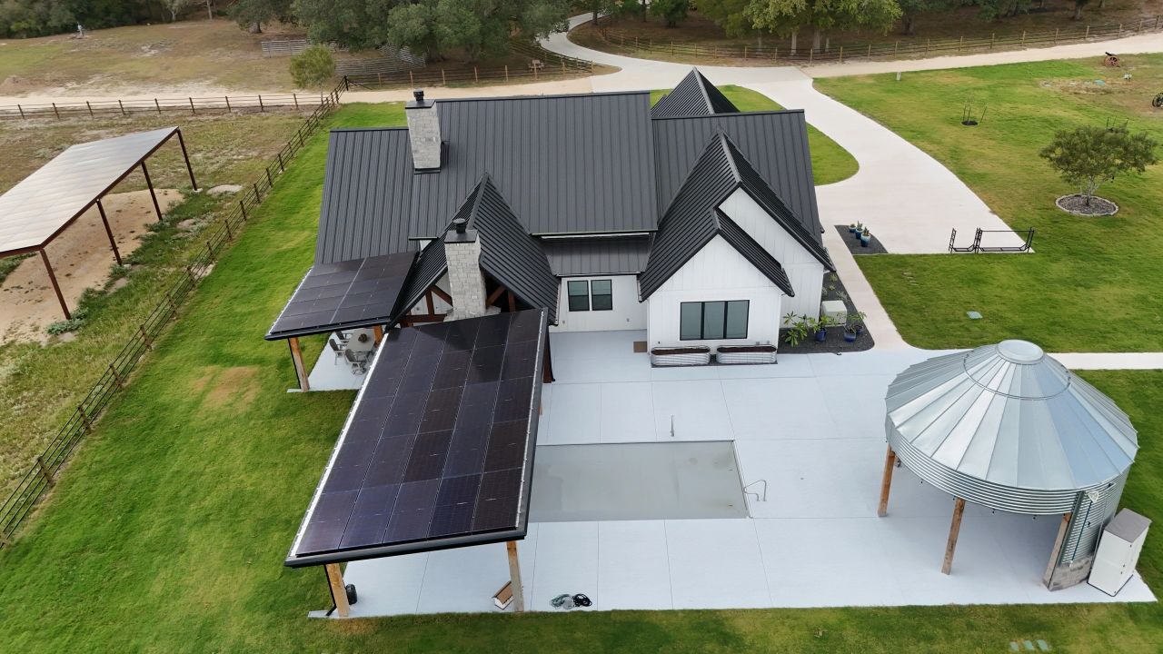 Ground-mount and roof solar array at a Texas ranch home